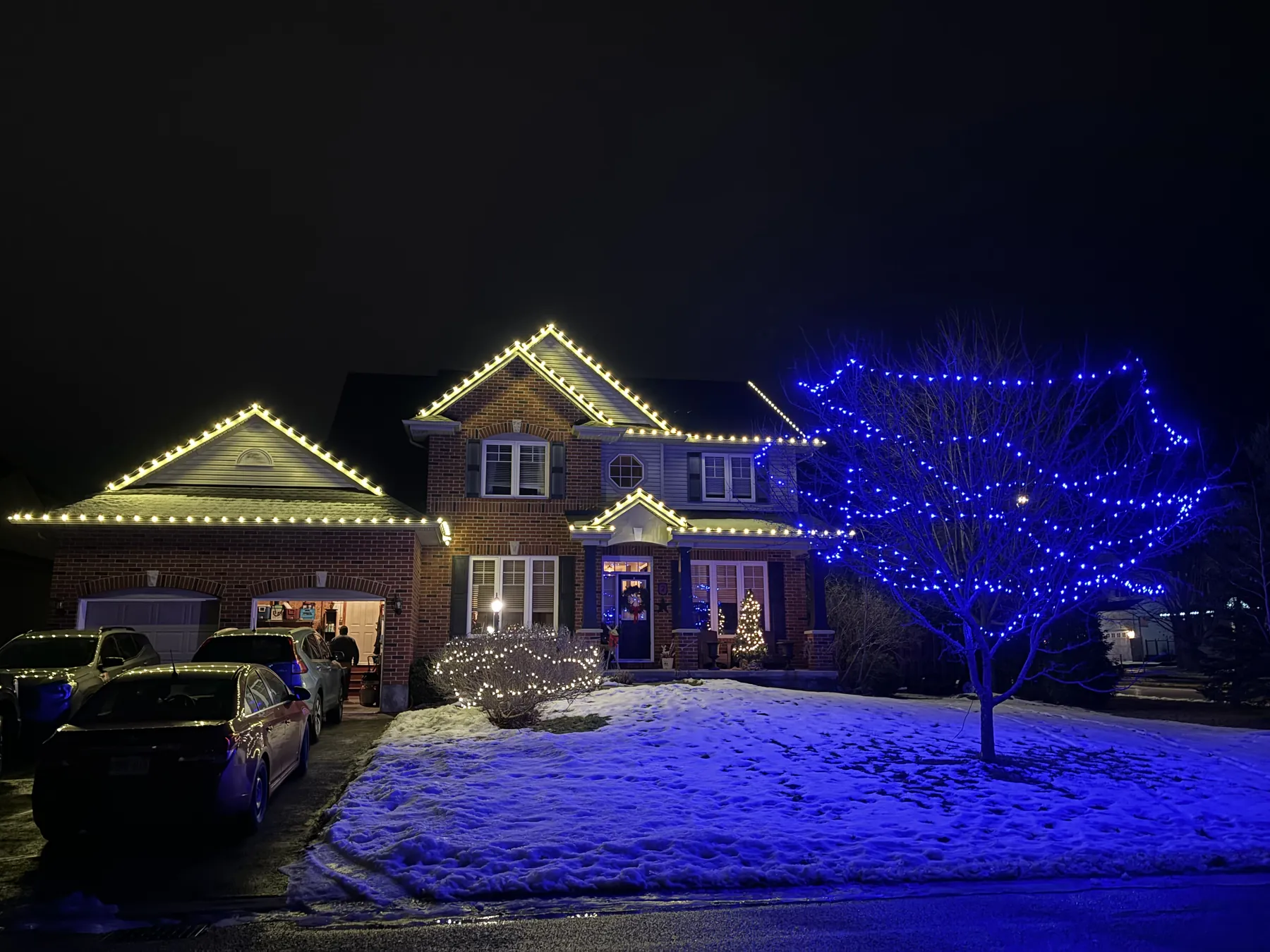 Colourful lights on a home at blue hour