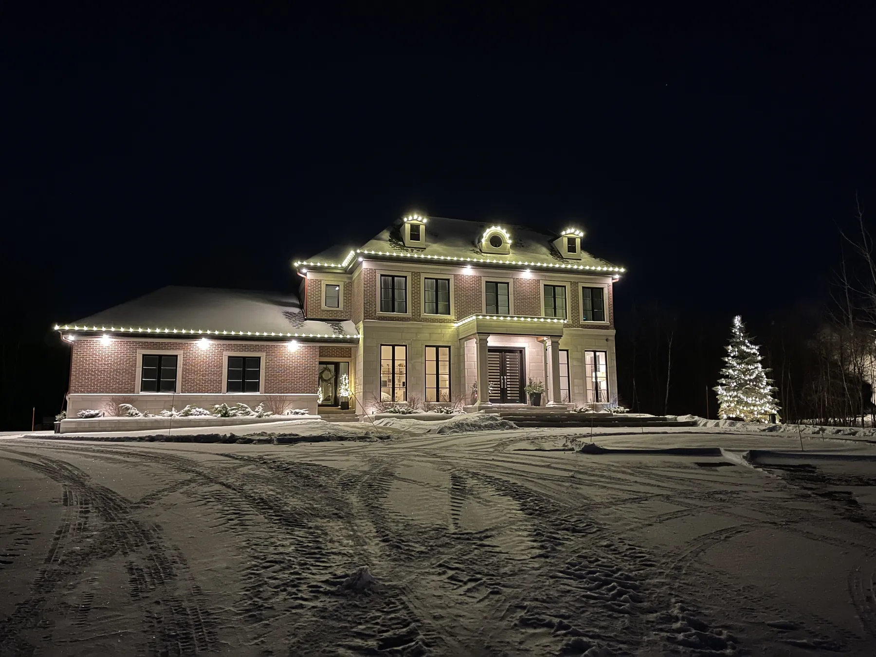 Property outlined in warm white lights