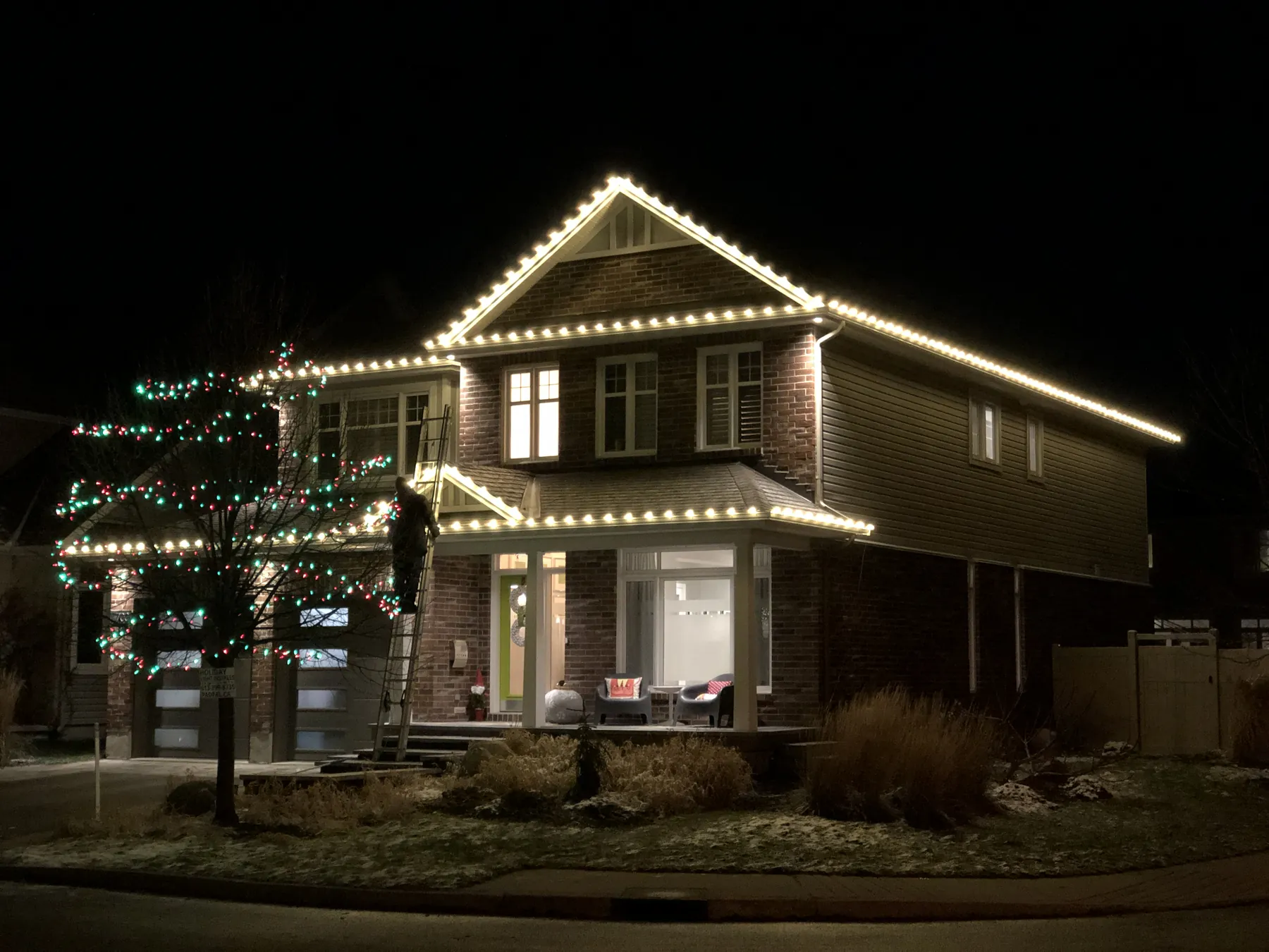 Warm white roofline lighting on a home